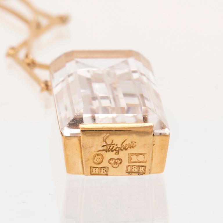 An 18K gold necklace set with a step cut rock crystal quartz by Ateljé Stigbert 1943.