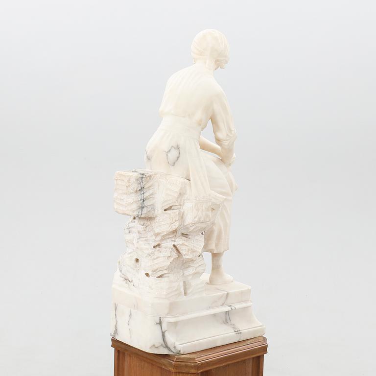 Decorative sculpture Seated woman with tambourine.