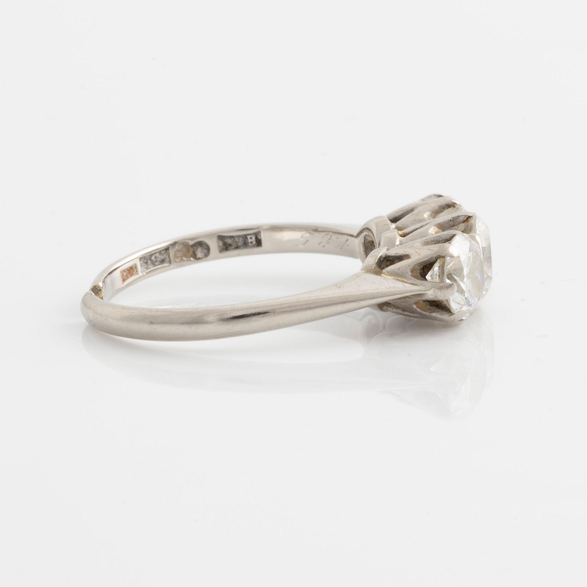 Ring with three brilliant-cut diamonds.