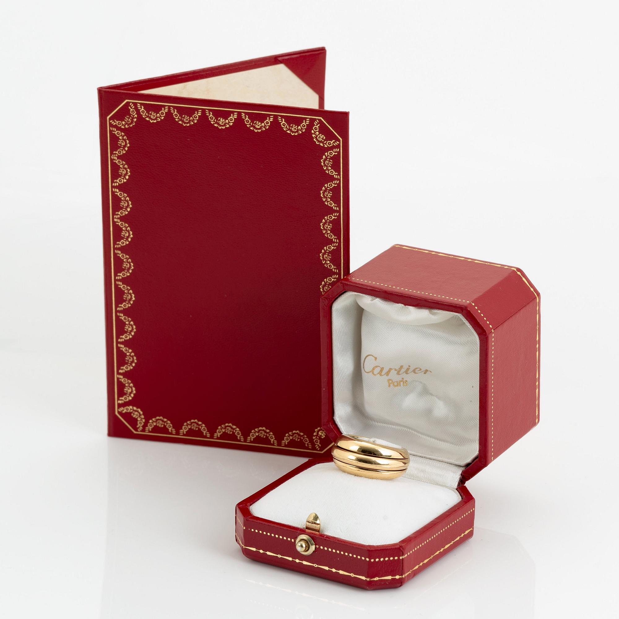 An 18K gold Cartier ring.