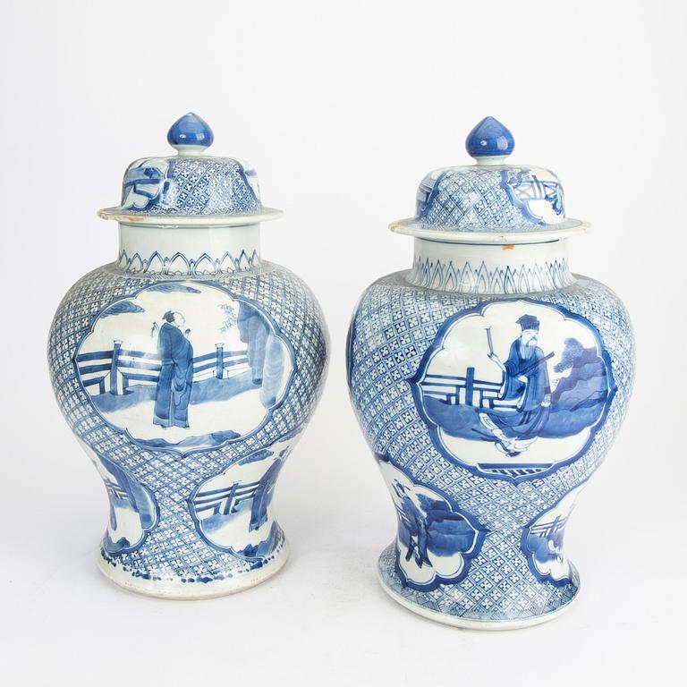 A pair of blue and white porcelain Kangxi style late Qing urns.