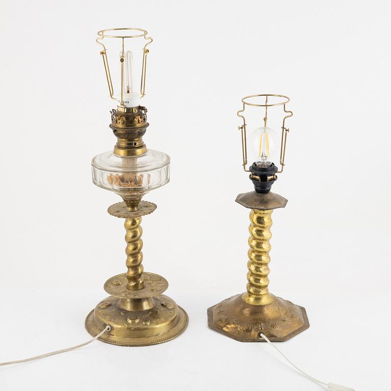 Two Baroque style brass table lamps from around the year 1900.