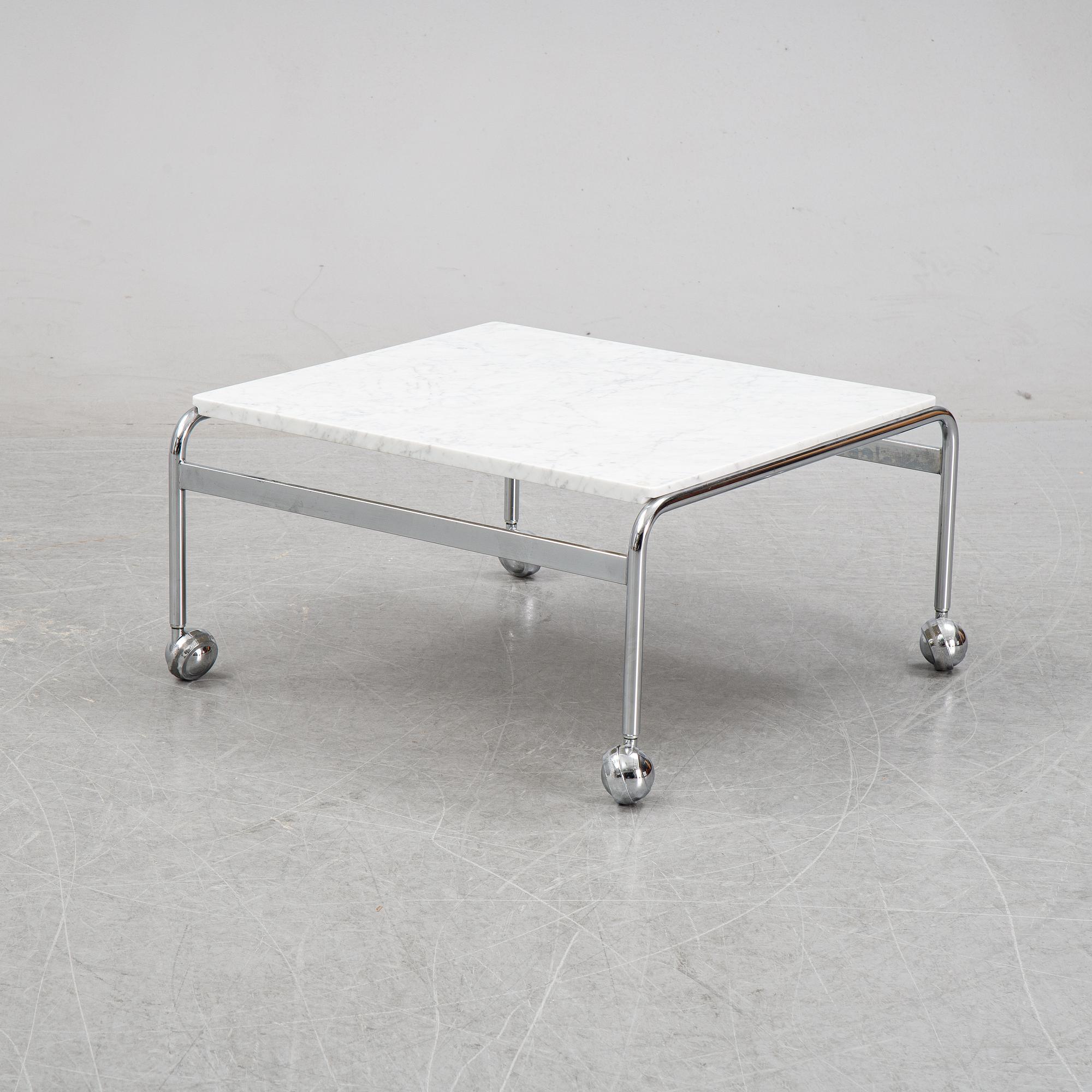 Bruno Mathsson, a pair of easy chairs and a coffee table, 'Karin', Dux, second half of the 20th Century.