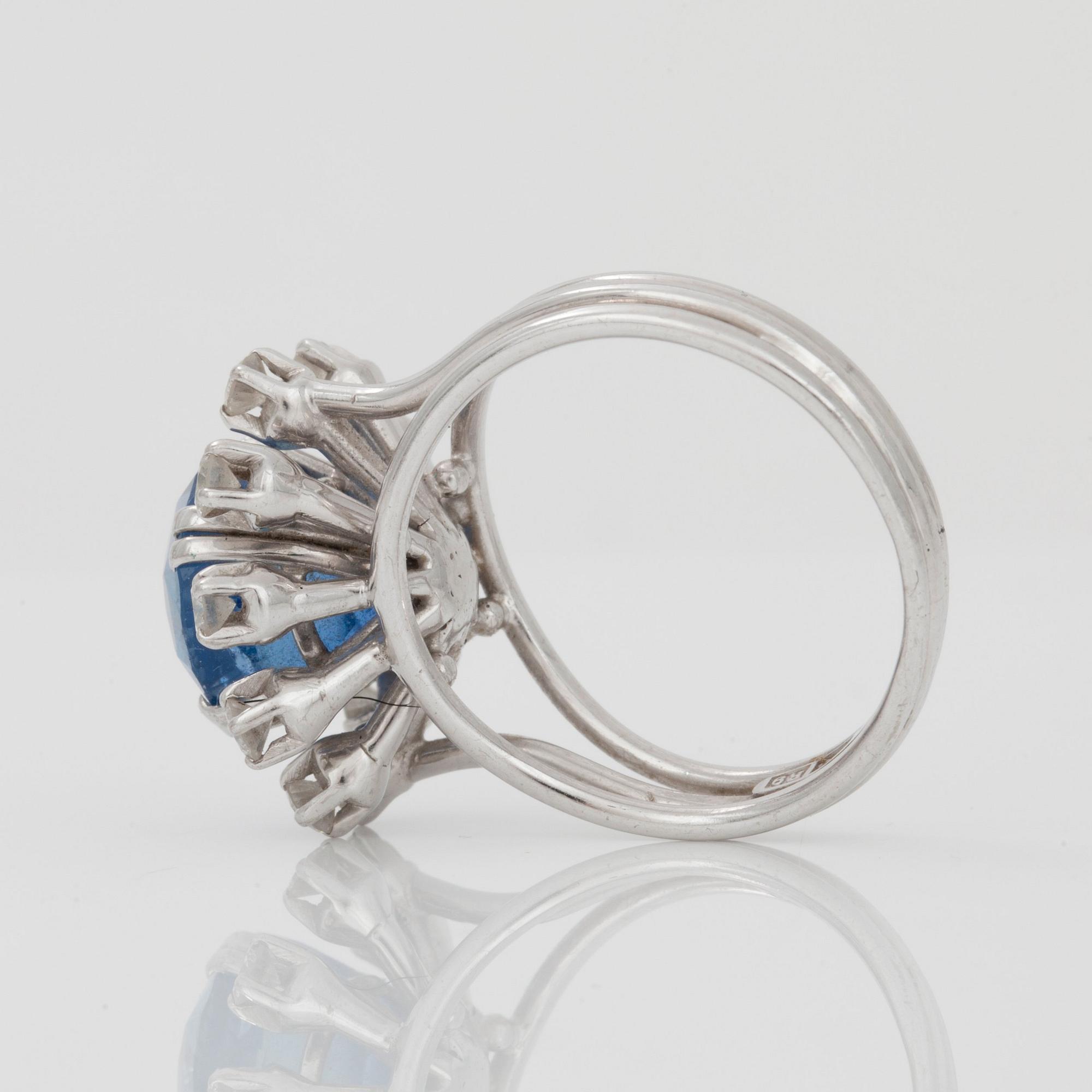 A sapphire and brilliant-cut diamond ring.