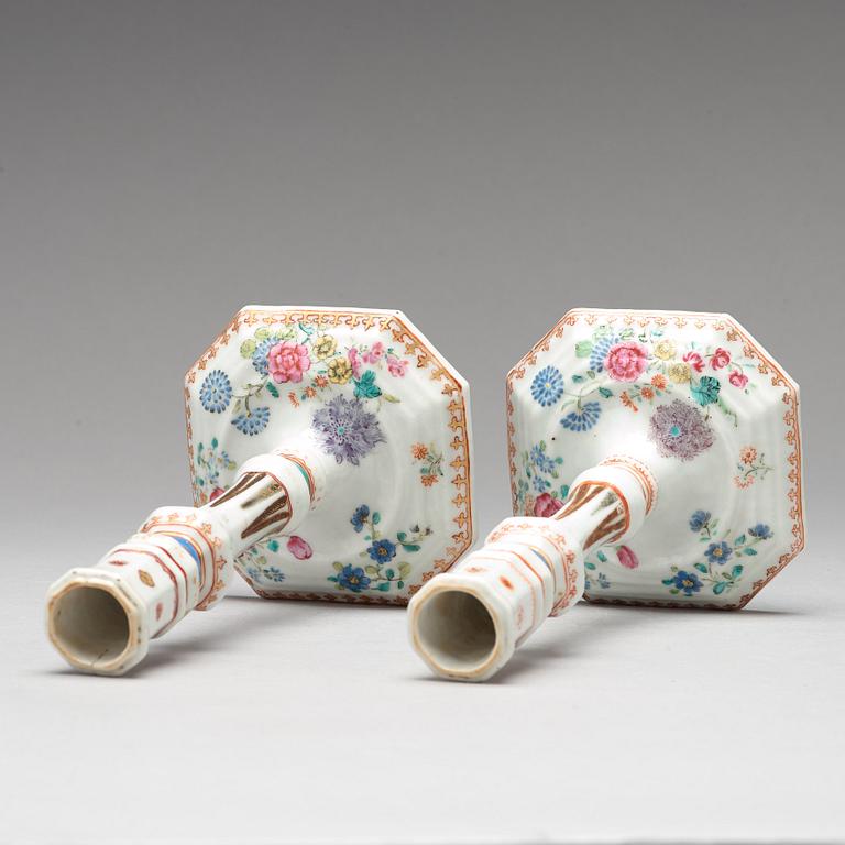 A pair of famille rose candle sticks, Qing dynasty, Qianlong (1736-95).