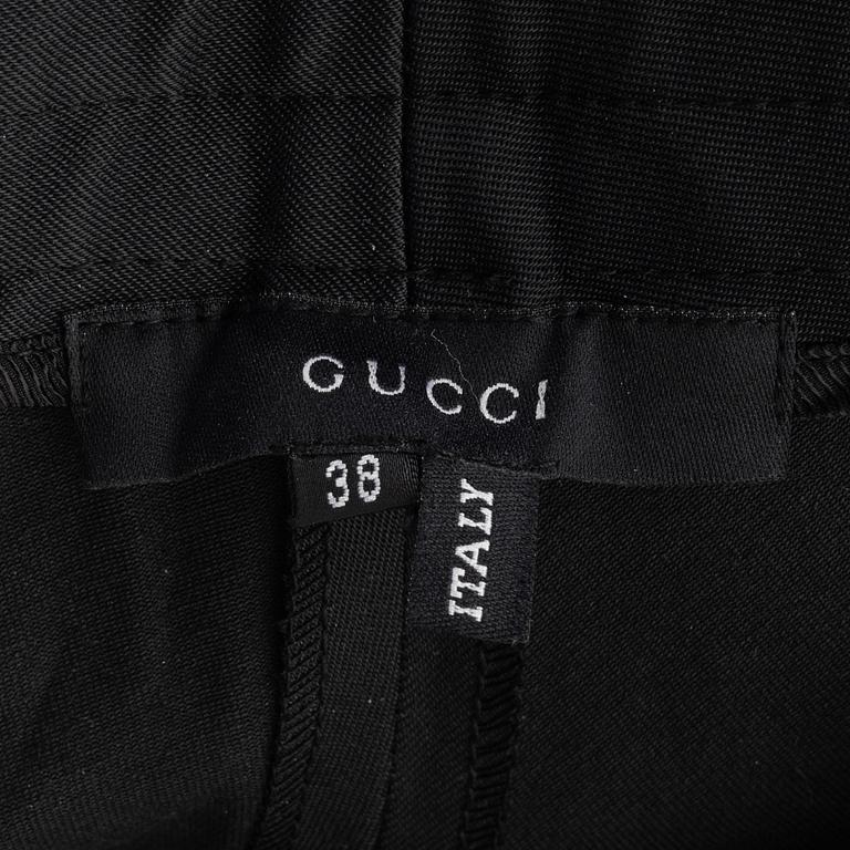 Gucci, a pair of black pants, size 38.