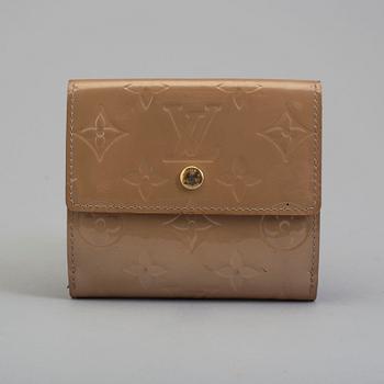 A beige monogram vernis wallet by Louis Vuitton.