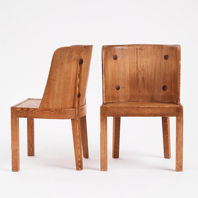 Axel Einar Hjorth, a pair of "Lovö" stained pine armchairs, Nordiska Kompaniet 1930s.