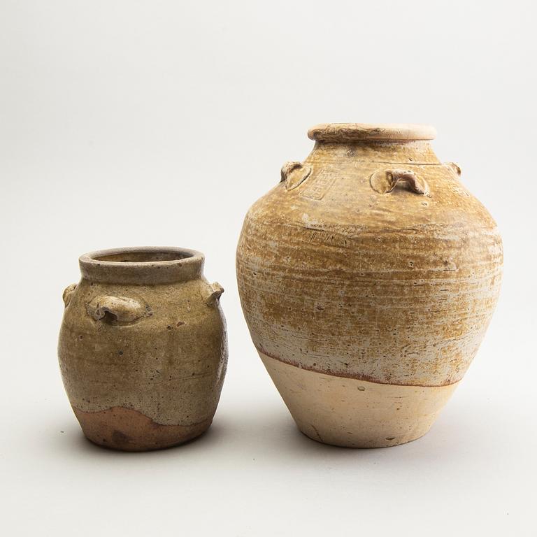 Two olive green glazed South East Asian jars, 14th/17th Century.