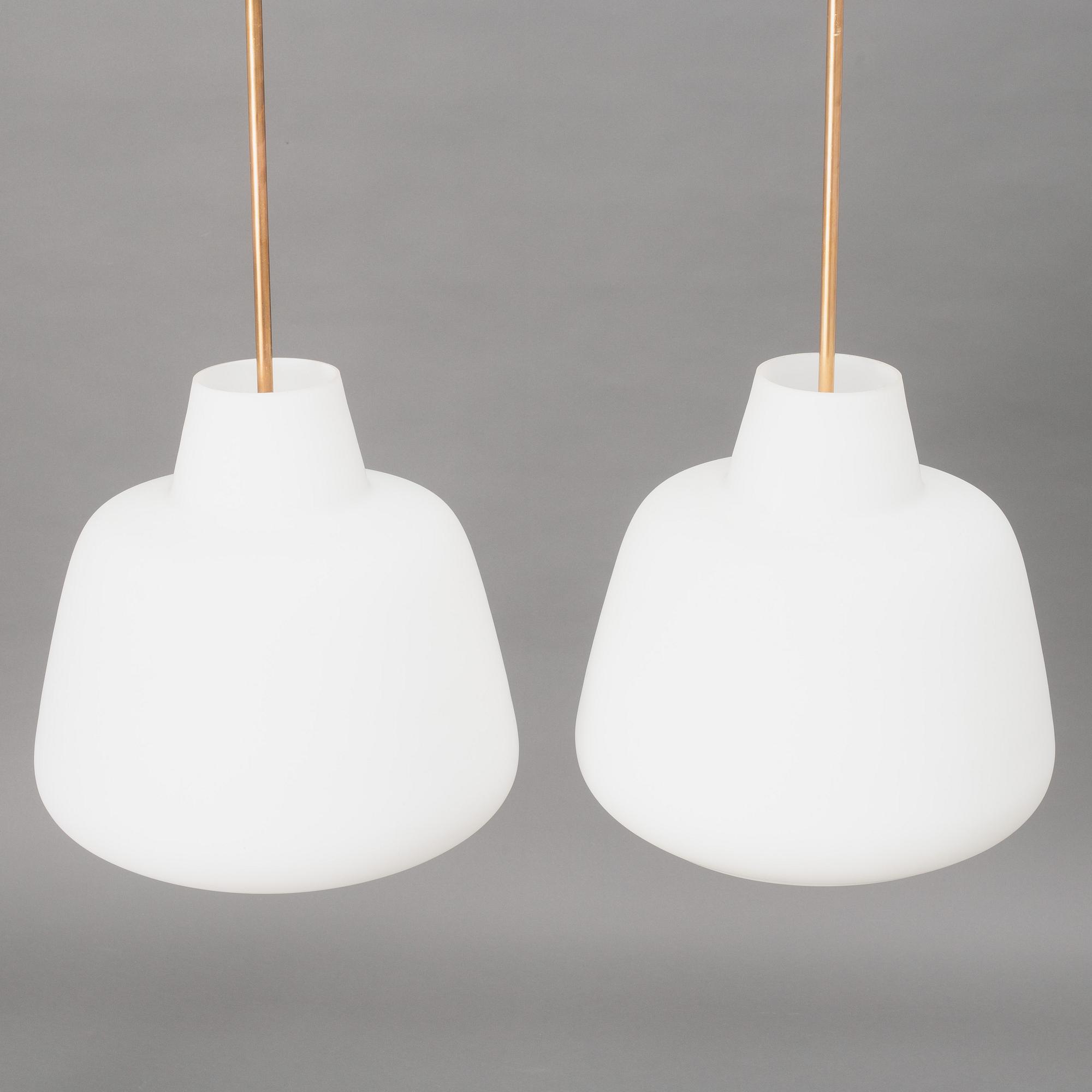 A pair of Swedish Modern ceiling lamps, mid 20th century.