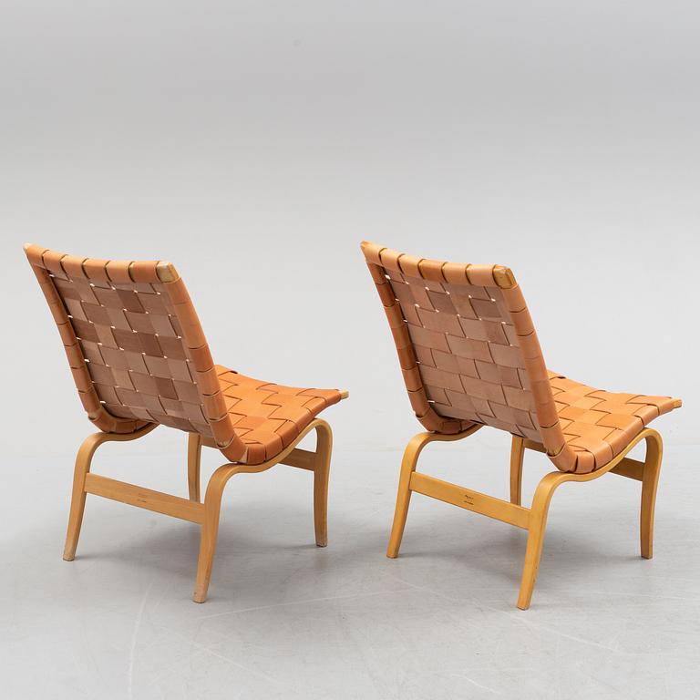 A pair of Bruno Mathsson 'Eva' lounge chairs, by Karl Mathsson, for VÄrnamo, 1965 and 1970.