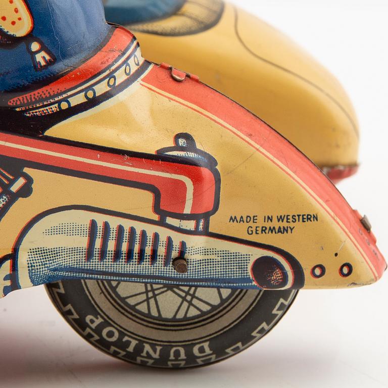 Toy motorcycle with sidecar. Huki Germany mid-20th century lithographed tin.