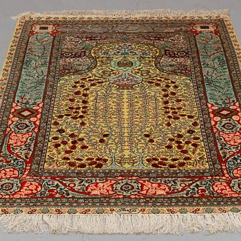 A CARPET, Oriental silk souf (relief), probably Chinese ca 184,5 x 124 cm.