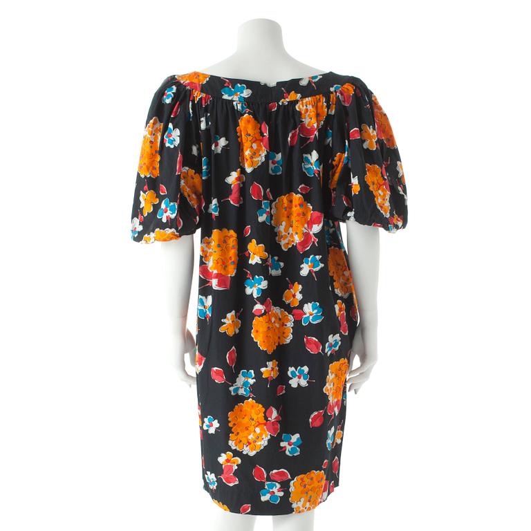YVES SAINT LAURENT, a black cotton dress with flower motif.