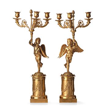 101. A pair of French Empire three-light candelabra, early 19th century.