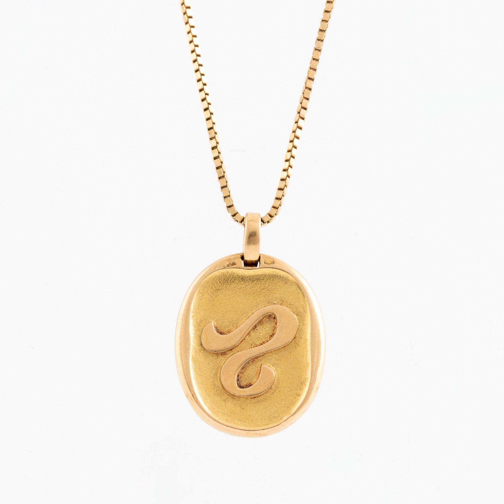 A Cartier Leo zodiac pendant.