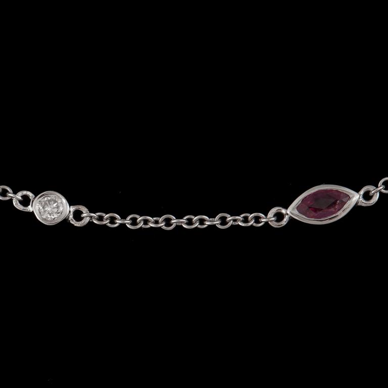 A ruby and diamond necklace.