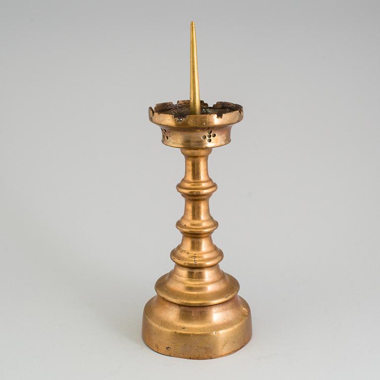 A GOTHIC STYLE BRONZE CANDLESTICK, 19th century.