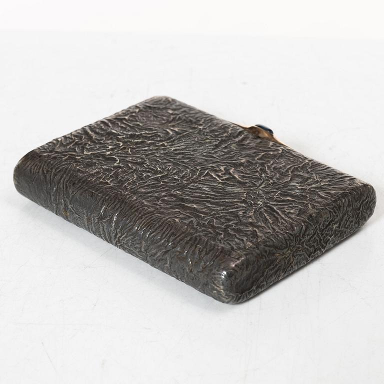 A Russian silver samorodok cigarette case, St. Petersburg 1908-17, unidentified maker's mark, possibly Ivan Arkarov.