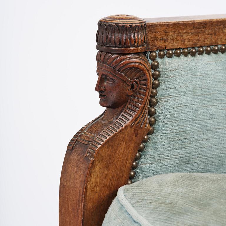 A pair of French Empire mahogny armchairs.