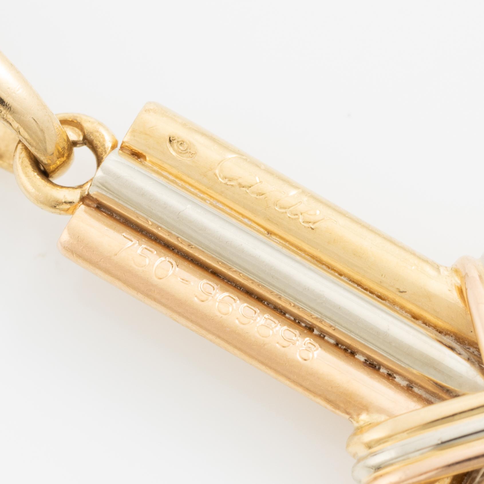 Cartier, A Cartier necklace 18K multi-coloured gold "Trinity" cross.