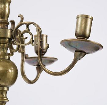 A four-branch baroque brass chandelier, late 17th century/circa 1700.