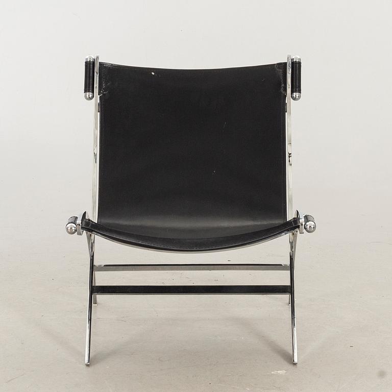 Paul Tuttle For Flexform Lounge Chair In Chrome And Black Leather.