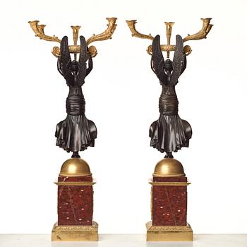 A pair of important five light Empire candelabra.