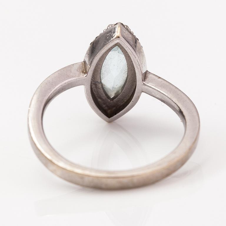 A 14K white gold ring with a topaz and diamonds ca. 0.12 ct in total. Faber art, Helsinki.