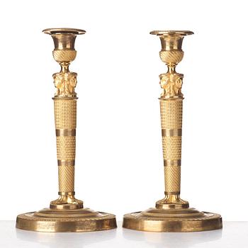 A pair of French Empire candlesticks, early 19th century.