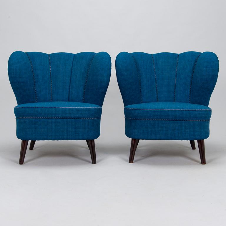 A pair of mid-20th-century armchairs.