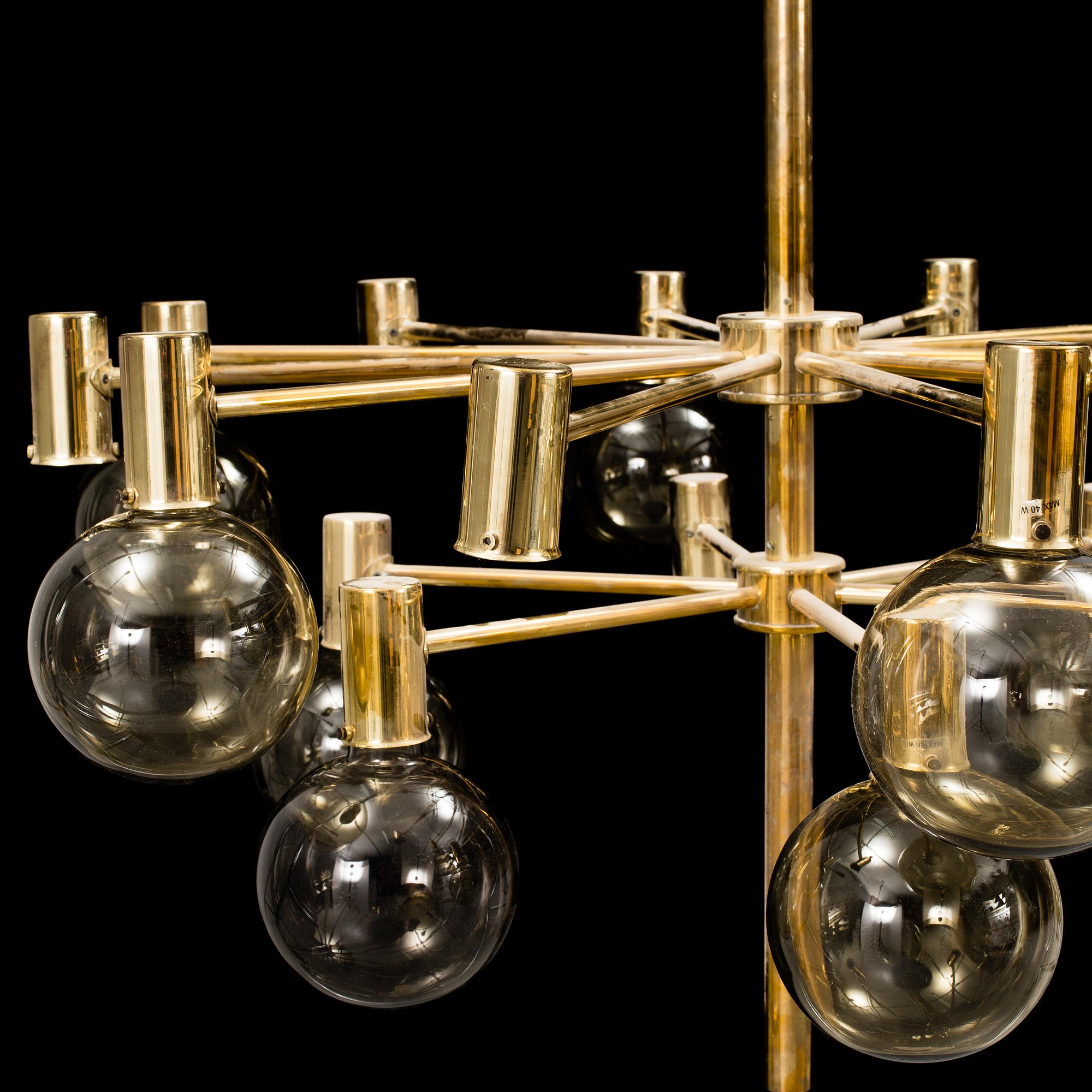 A 20th century brass and smoked glass chandelier by Hans Agne Jakobsson, Markaryd, Sweden.