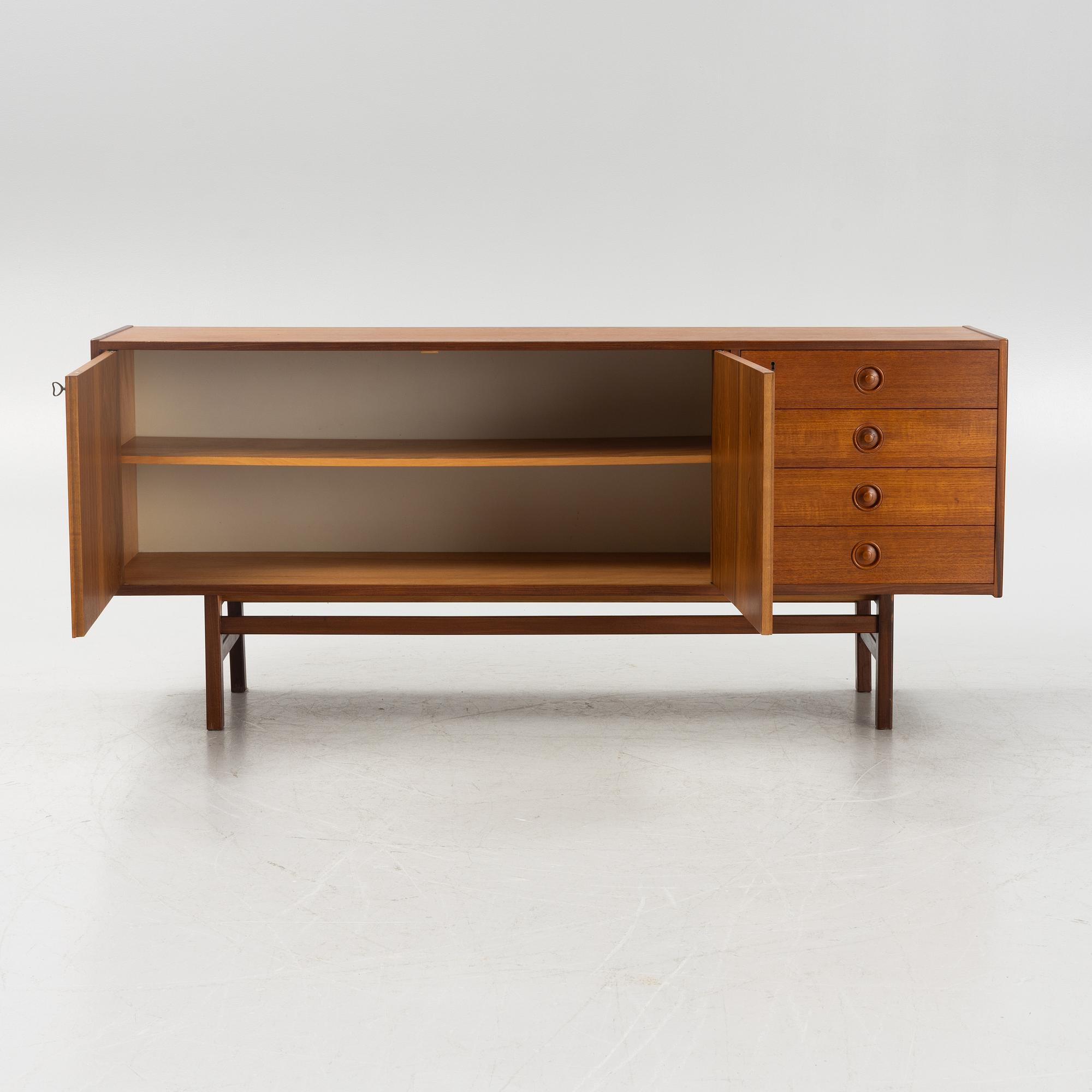 A 1960's teak-veneered sideboard.