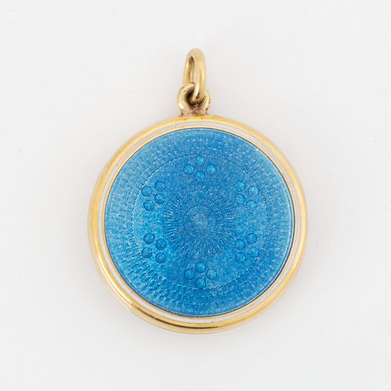 An enamel locket set with an old-cut diamond.