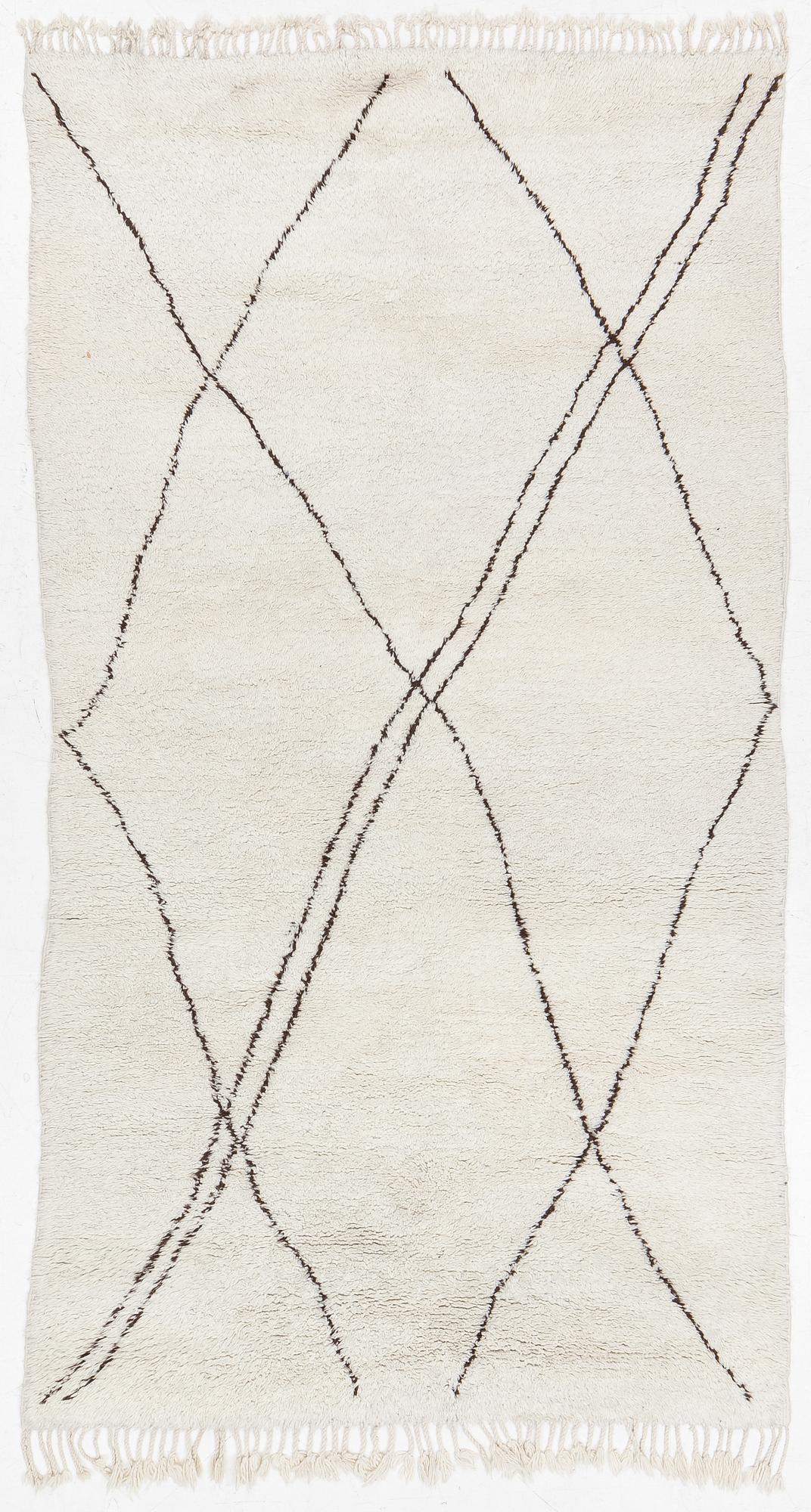 A Moroccan carpet, c. 282 x 150 cm.