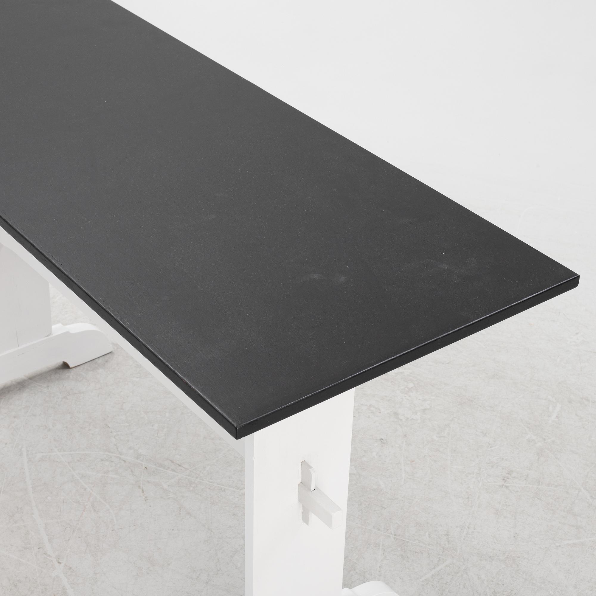 A painted table, 20th Century.
