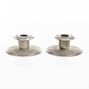 Two pairs of Persian silver candle holders, 20th century.