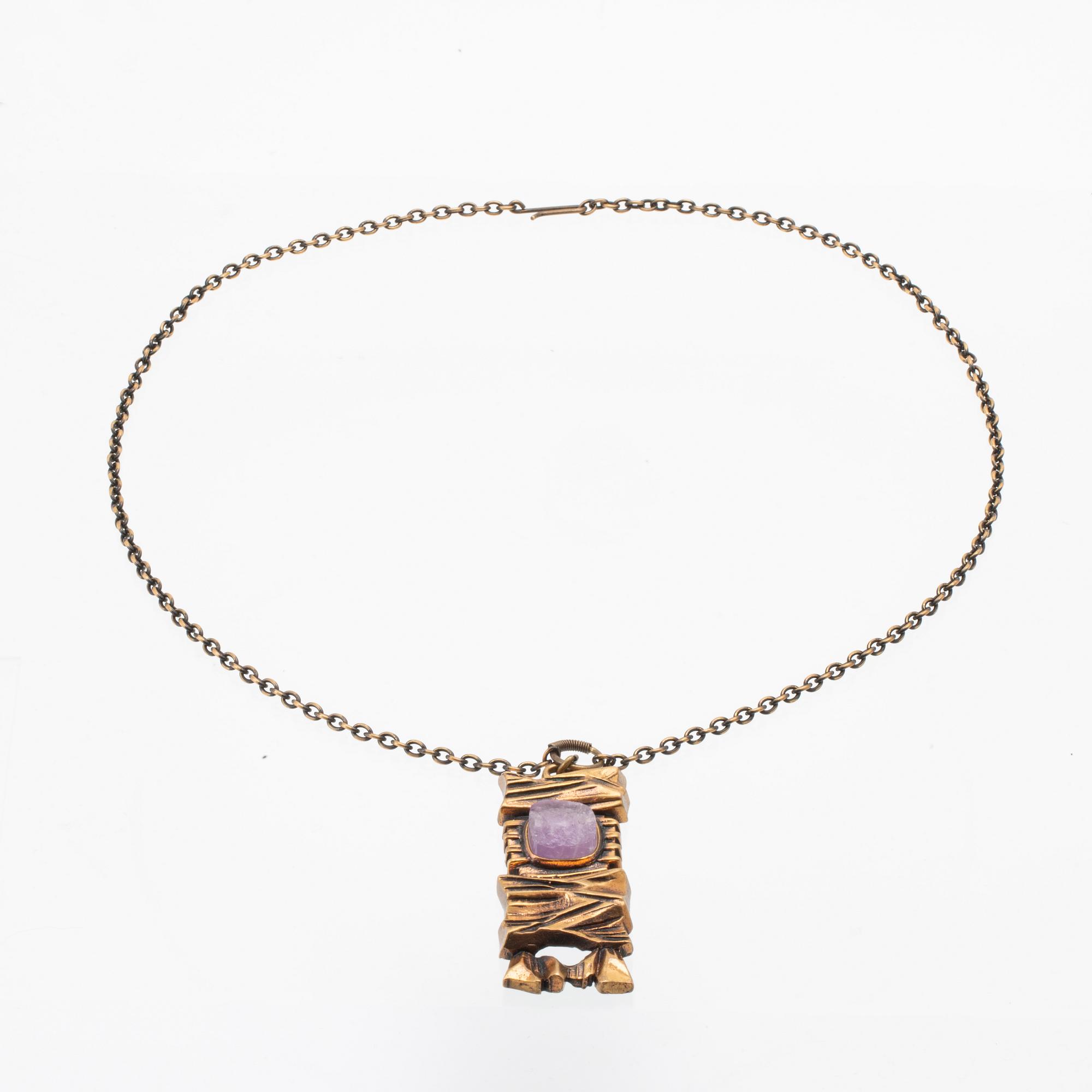 A bronze necklace set with an amethyst by Pentti Sarpaneva.