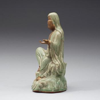 A seated celadon figure of Guanyin, presumably Longquan Ming dynasty, 17th Century.