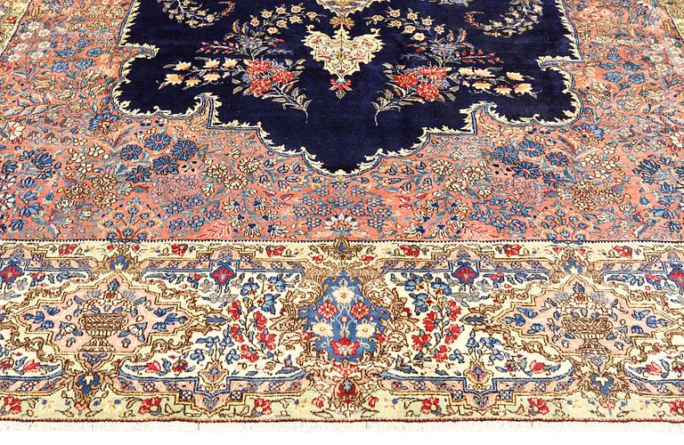 A semi-antique Kerman carpet, approximately 358 x 268 cm.