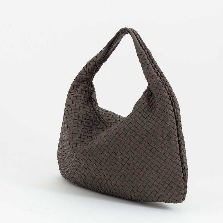 Bottega Veneta, a grey intrecciato leather bag.