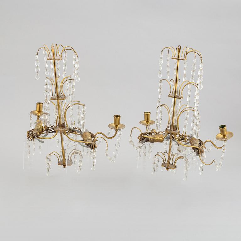 A pair of brass wall sconces, first half of the 20th century.