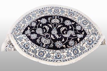 A rug, Nain, part silk, diameter ca 140 cm.