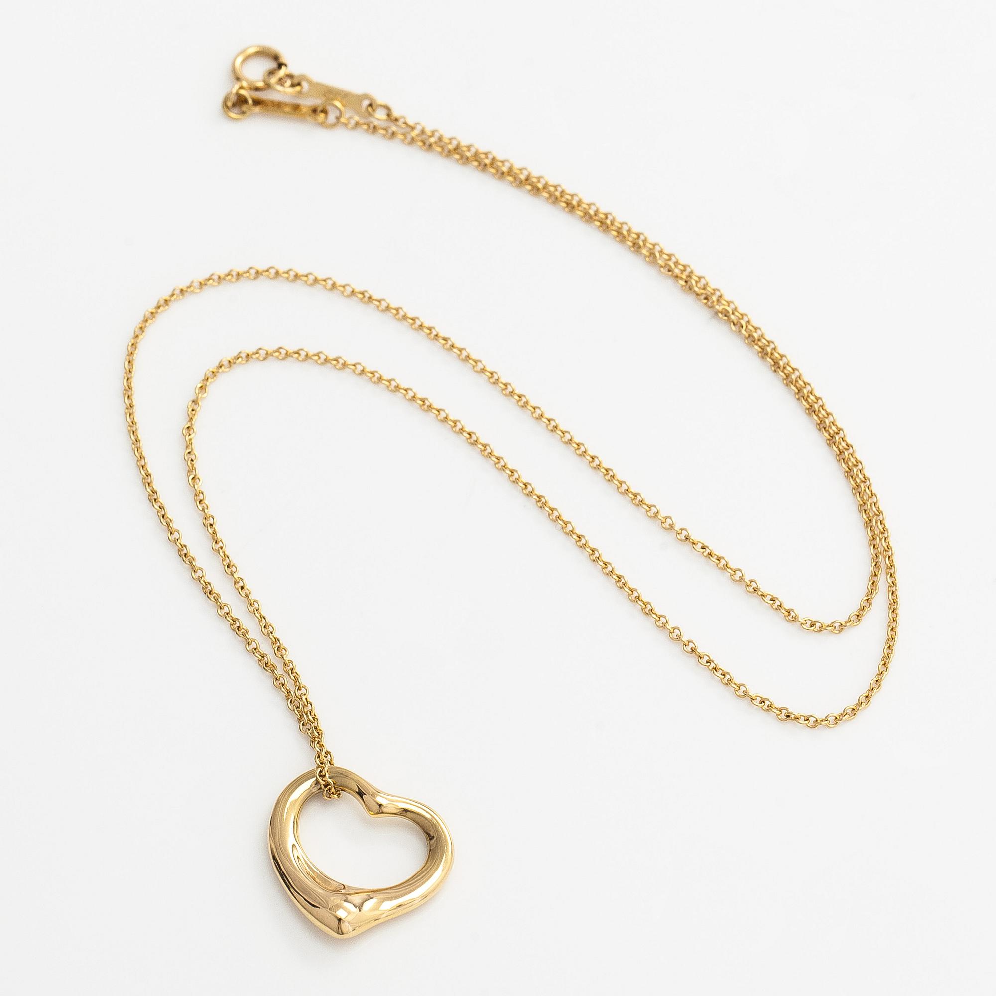 Tiffany & Co, Elsa Peretti, an 18K gold "Open Heart" necklace.