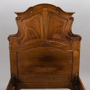 A pair of early 20th Century art nouveau style beds.