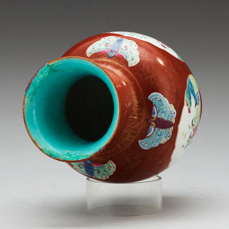 A coral ground famille rose vase, Qing dynasty.