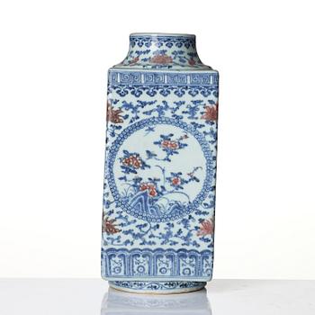 An underglaze blue and copper-red 'crane and deer' cong vase, Qing dynasty, 18/19th century.