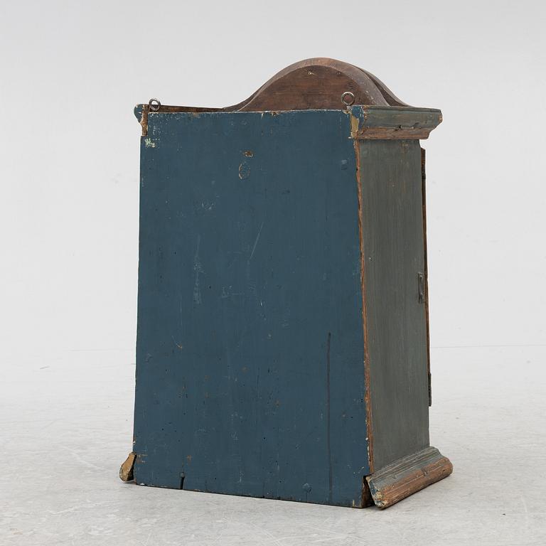 A painted wall cabinet, 19th century.