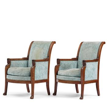 81. A pair of French Empire mahogny armchairs.