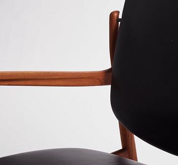 Finn Juhl, a teak and black leather 'model 136' easy chair, France & Daverkosen, Denmark 1950-60s.